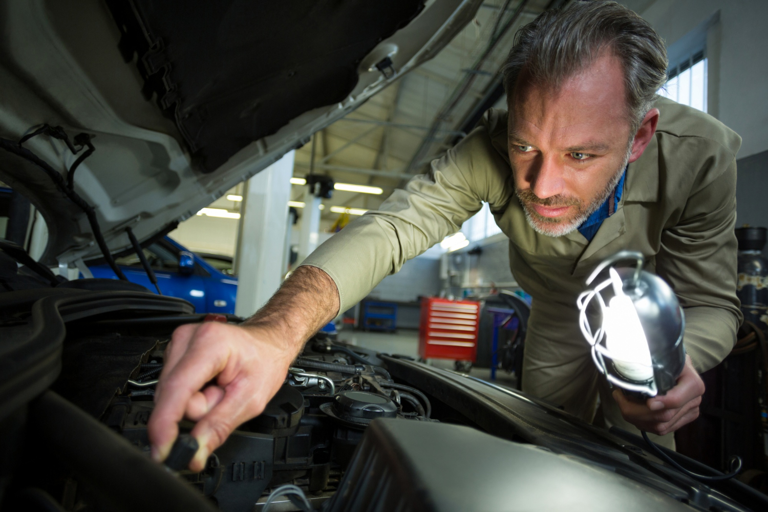 mechanic examining engine