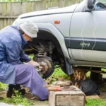 repairing a car at home in backyard (1)