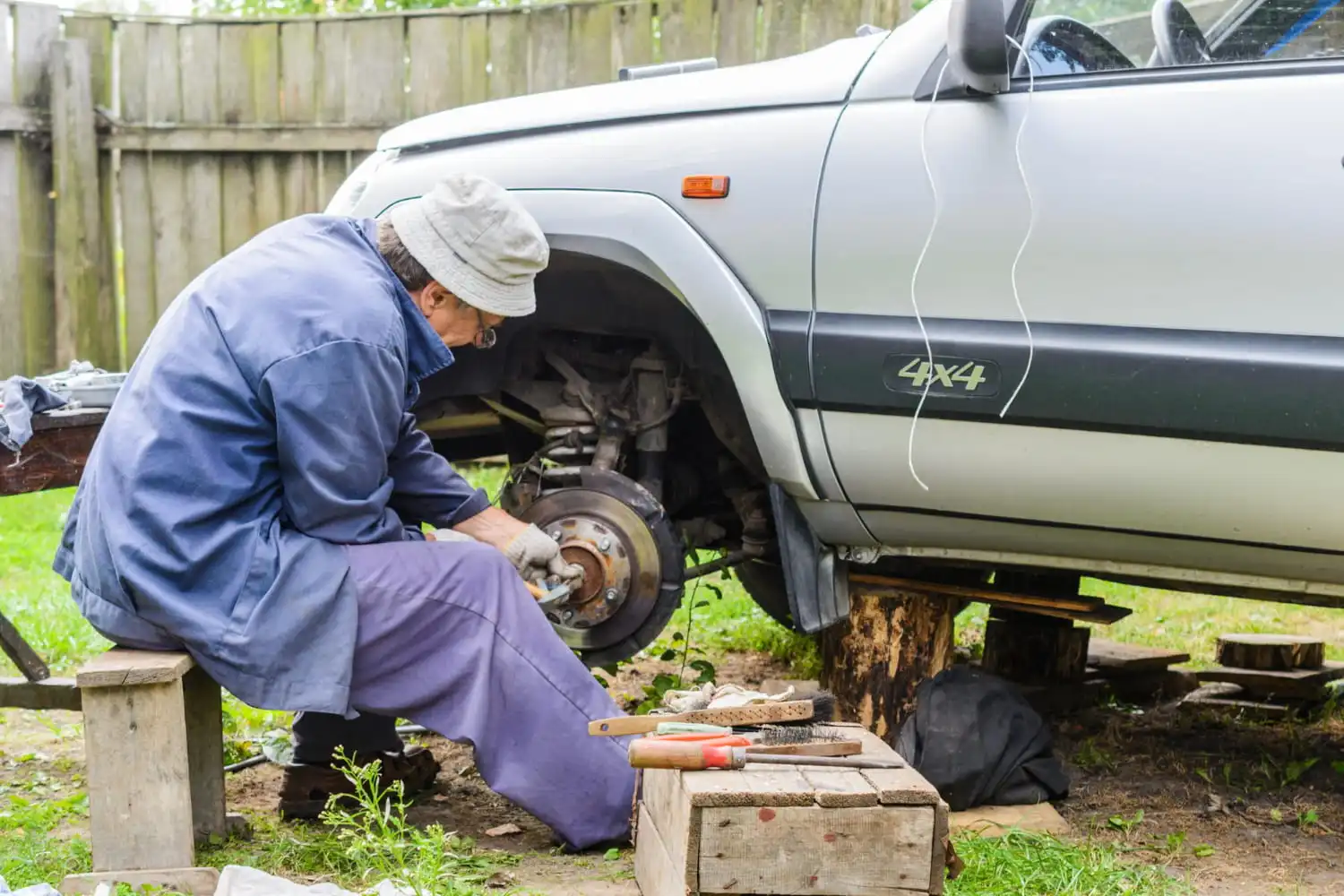 repairing a car at home in backyard (1)